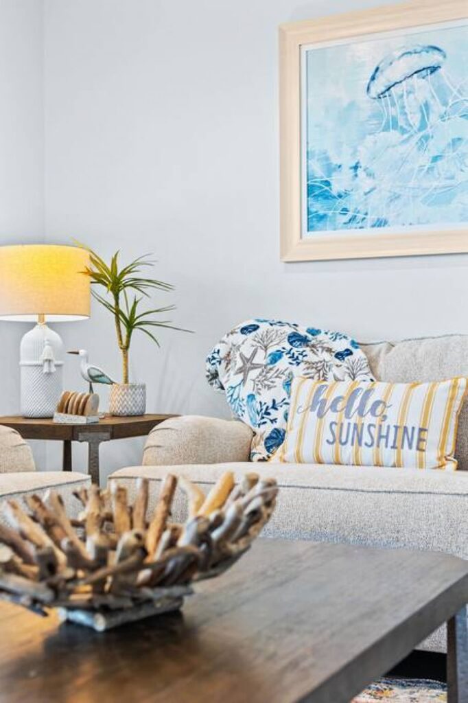 Coastal charm living room interior by Kindred Design, featuring short-term rental decorating expertise.